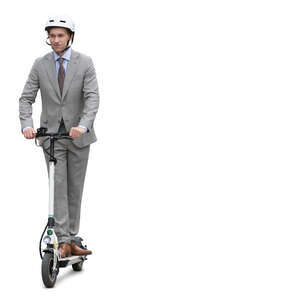 businessman in a grey suit and wearing a helmet riding a scooter