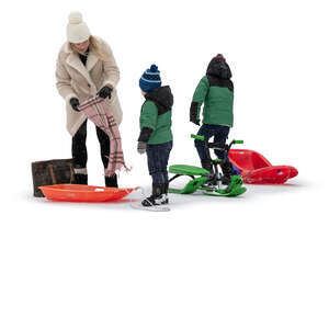 family with two kids going sledging