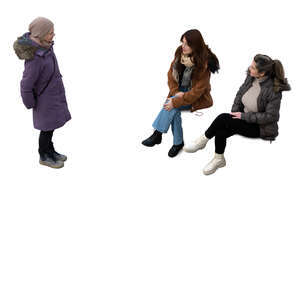 three women in winter talking seen from above