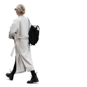 woman in a long white cardigan walking