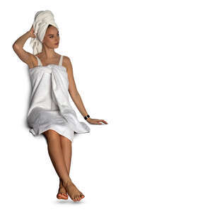 cut out woman in a white spa towel sitting in a sauna