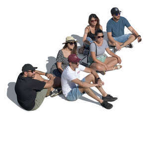 group of friends sitting on the ground seen from above