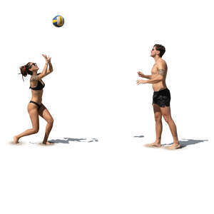 man and woman playing volleyball at the beach