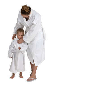 mother and son in white spa bathrobes standing