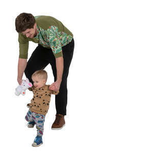 man helping his little son walk down the stairs