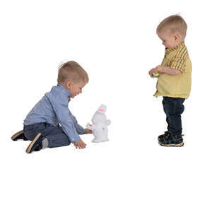 two boys playing with a toy rabbit