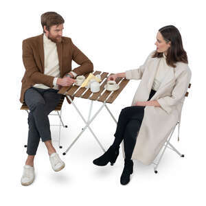 man and woman sitting in a cafe seen from above