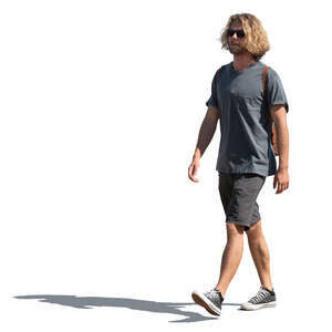 young man in shorts walking