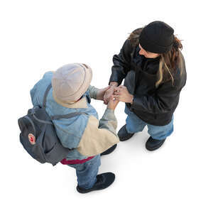 top view of two people standing and holding hands