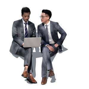 two asian businessmen sitting and discussing