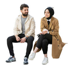 muslim woman and man sitting and talking