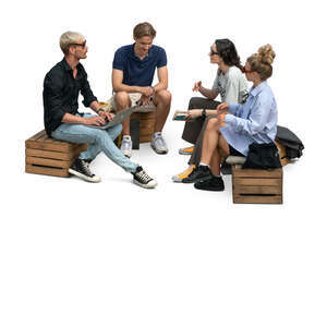 group of young people sitting on wooden crates