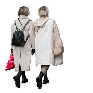 two women wearing light beige overcoats walking