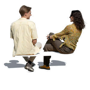 man and woman sitting and talking