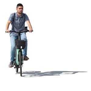 sidelit man riding a bike