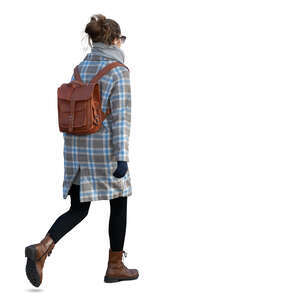 woman with a leather backpack walking