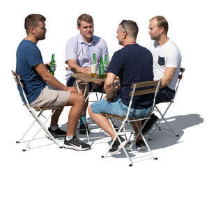 group of men sitting in an outdoor cafe