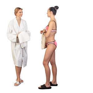 two women in a spa in bathing suits standing and talking