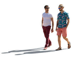 two backlit men walking