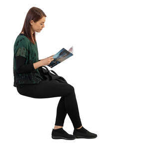 woman sitting and reading a magazine