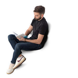 man sitting and reading a book seen from above