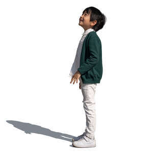 little asian boy standing and looking up