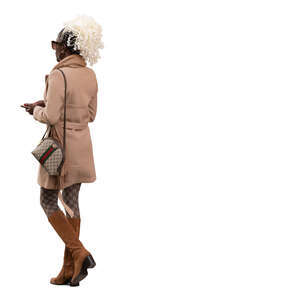 black woman in a trendy brown overcoat walking