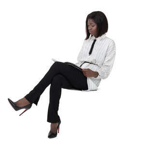 black woman sitting and reading