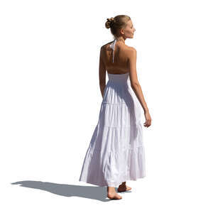 woman in a white dress walking barefoot