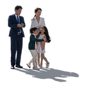 backlit asian family with two playful kids standing