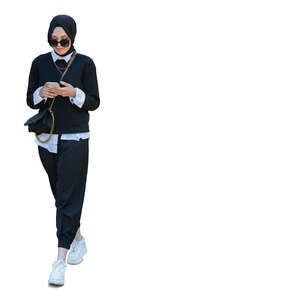 young stylish muslim woman walking