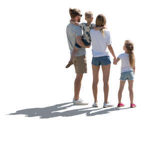 backlit family with two kids standing