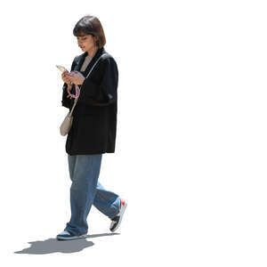 backlit dark haired woman  walking