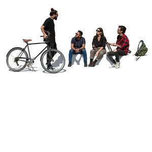 man with bike standing and talking to his friends