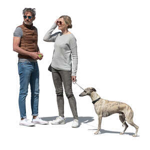 man and woman with a dog standing outside