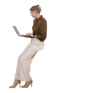 woman with a laptop leaning on a table
