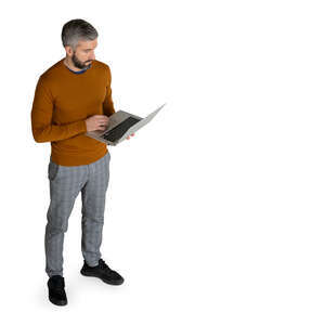 man with a laptop standing seen from above