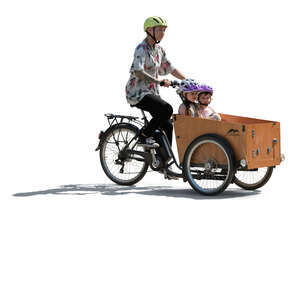 backlit family riding a cargo bike