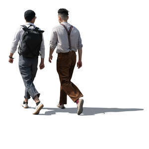 two backlit stylish men walking