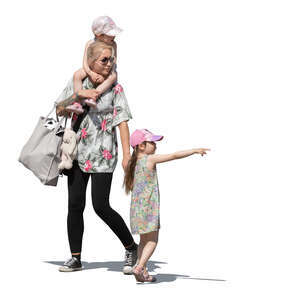 woman with two little daughters walking