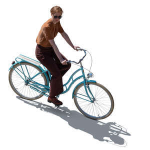 top backlit view of a woman riding a bike