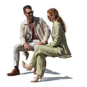 man and woman sitting outside and talking