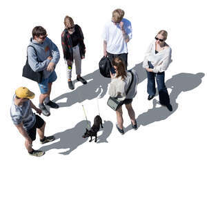 group of young people and a dog standing seen from above