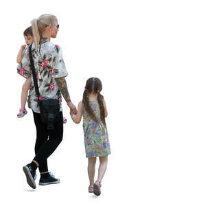 woman with two girls walking hand in hand