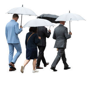 group of businessmen and businesswomen with umbrellas walking