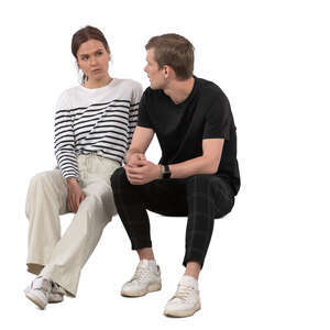 man and woman sitting and talking