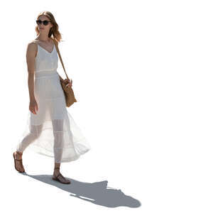 woman in a white summer dress walking