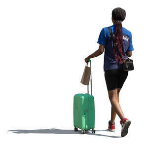 black woman with a suitcase walking