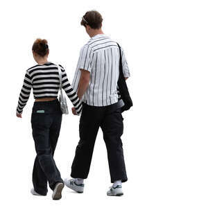 young trendy couple walking and holding hands