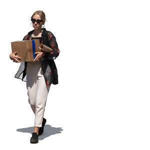 woman walking and carrying a cardboard box 